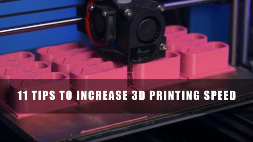 A 3D printer prints several pink plastic cases.