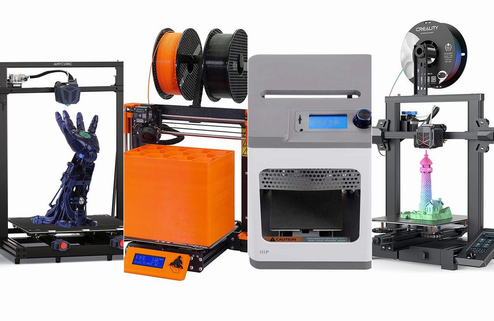 Four 3D printers, from left to right: Anycubic Mega X, Creality Ender 3, LulzBot Mini 2, and Creality CR-10 Smart Pro.
