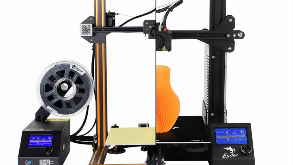 Two 3D printers, one printing a grey object and the other printing an orange vase.