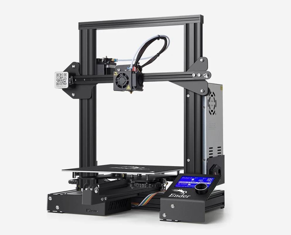 The image shows a black Creality Ender 3 V2 3D printer with a textured glass print bed.