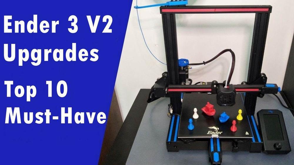 The image shows a Creality Ender 3 V2 3D printer with various colorful 3D printed upgrades.