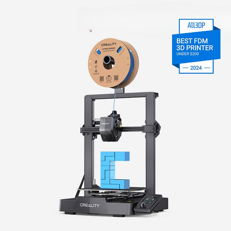 The image shows a black Creality Ender 3 V2 3D printer with a blue filament spool on top of it, printing a blue object.