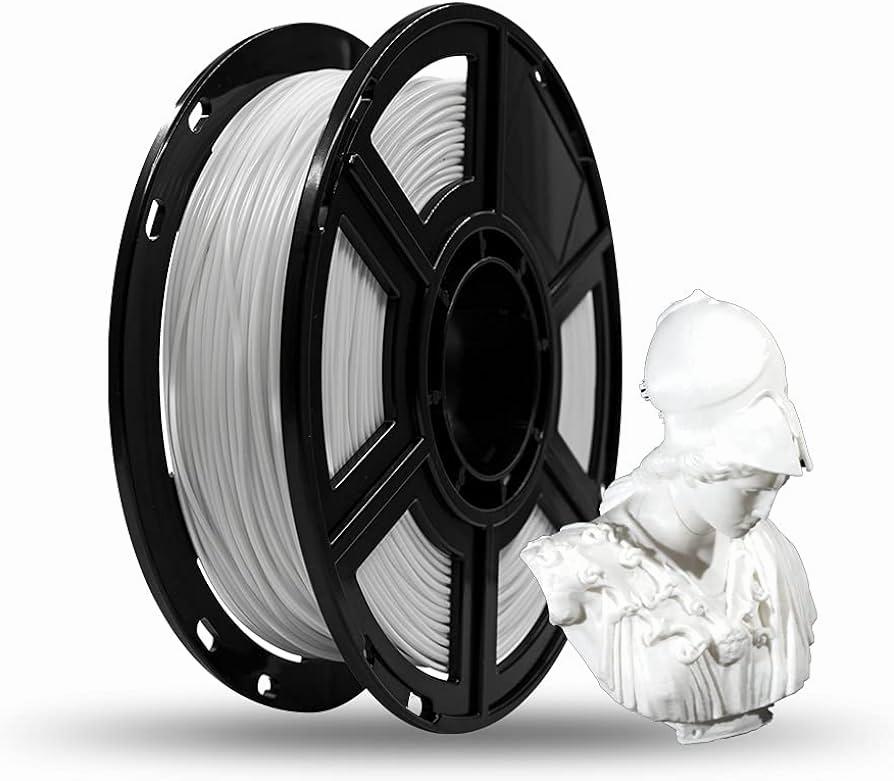 A white spool of 3D printer filament next to a 3D printed bust of a woman.