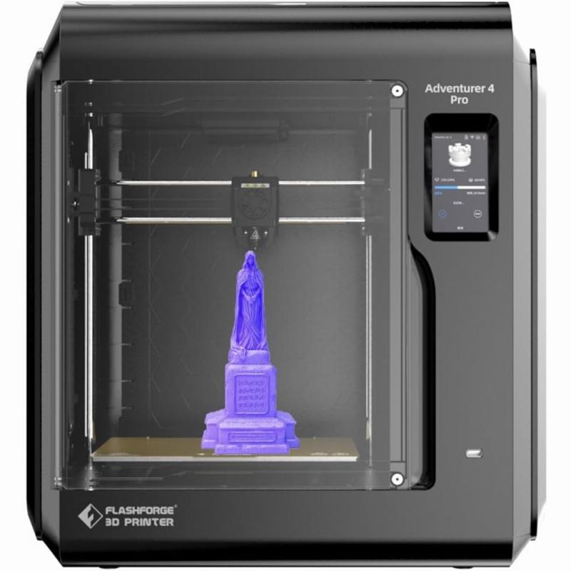 The image shows a black 3D printer with a blue statue of the Virgin Mary on the print bed.