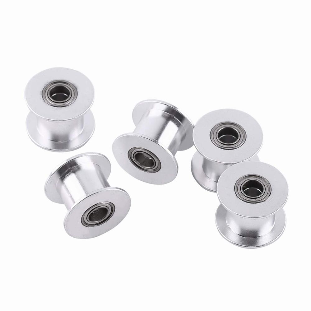 Five small silver metal pulleys with ball bearings.