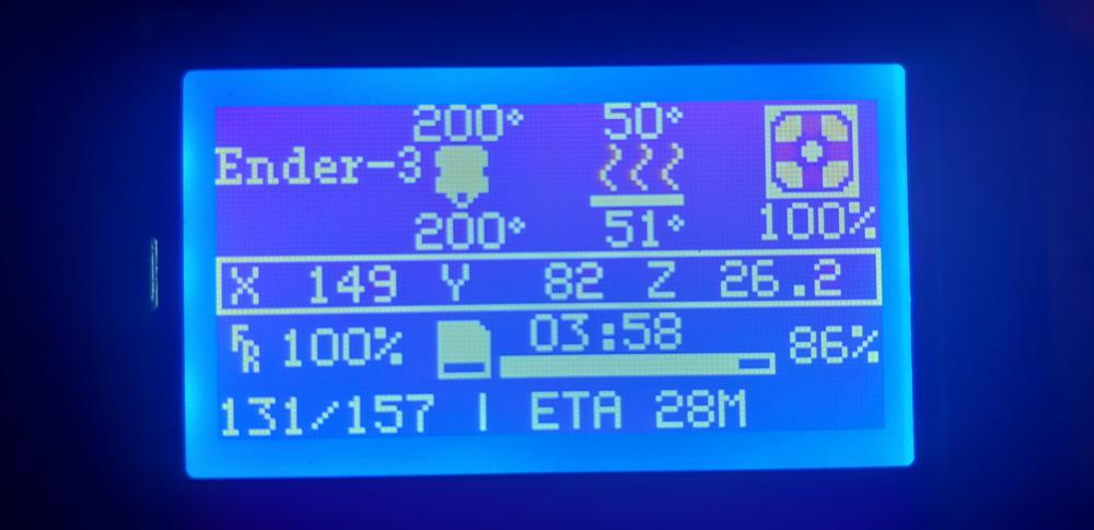 A blue screen with white text displaying the temperature, progress, and estimated time remaining of a 3D printer.