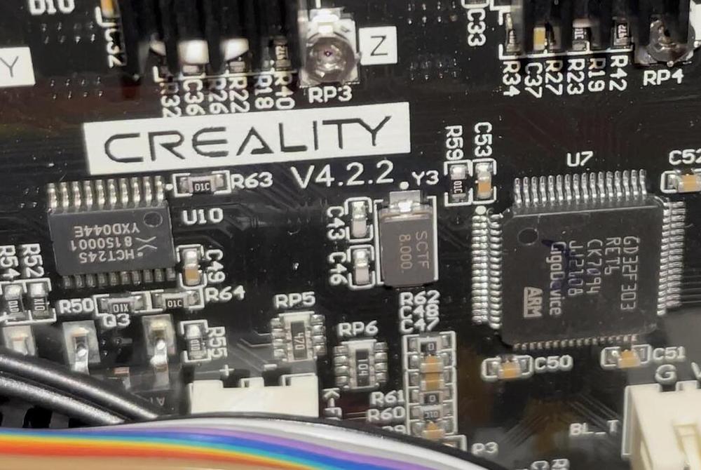 A close up of a circuit board with a Creality logo.
