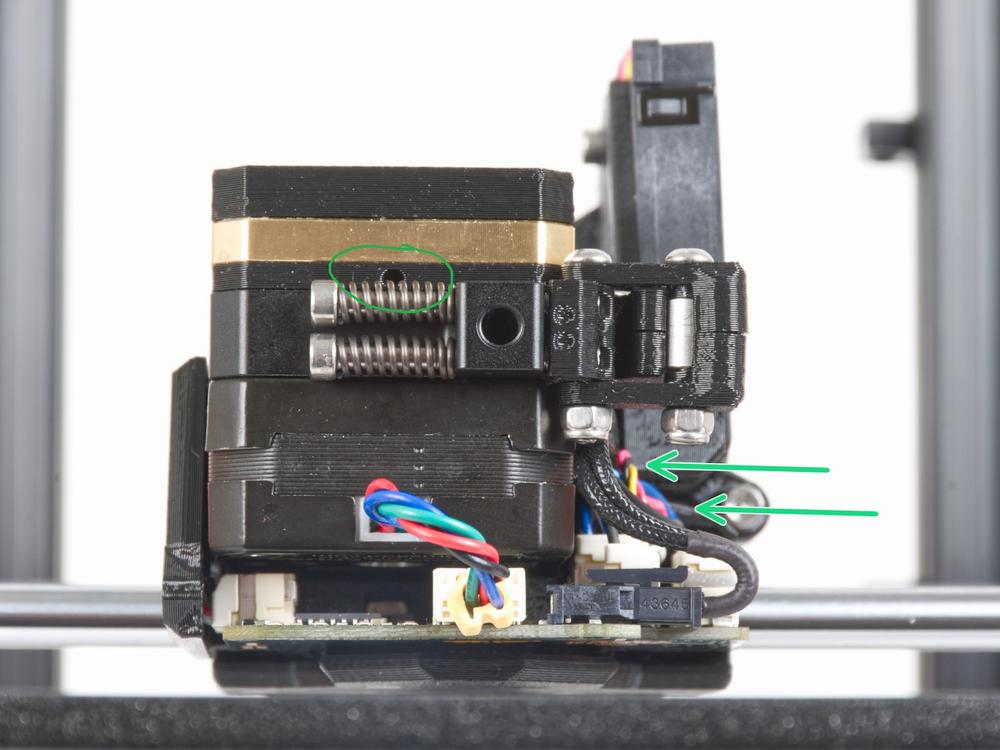 The green circle highlights one of the two Z-axis motor couplers on the left side of the printer.