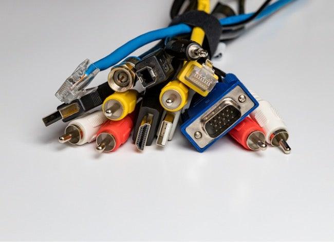 A variety of cables with different connectors are bundled together.