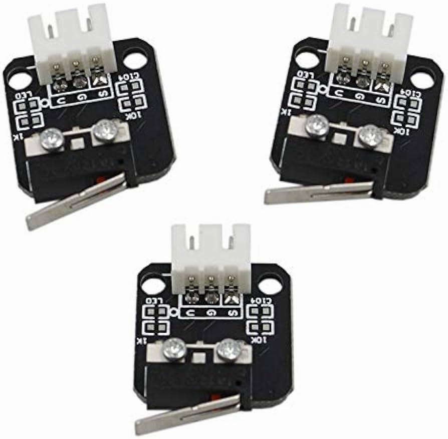 Three black electronic switches with white connectors.