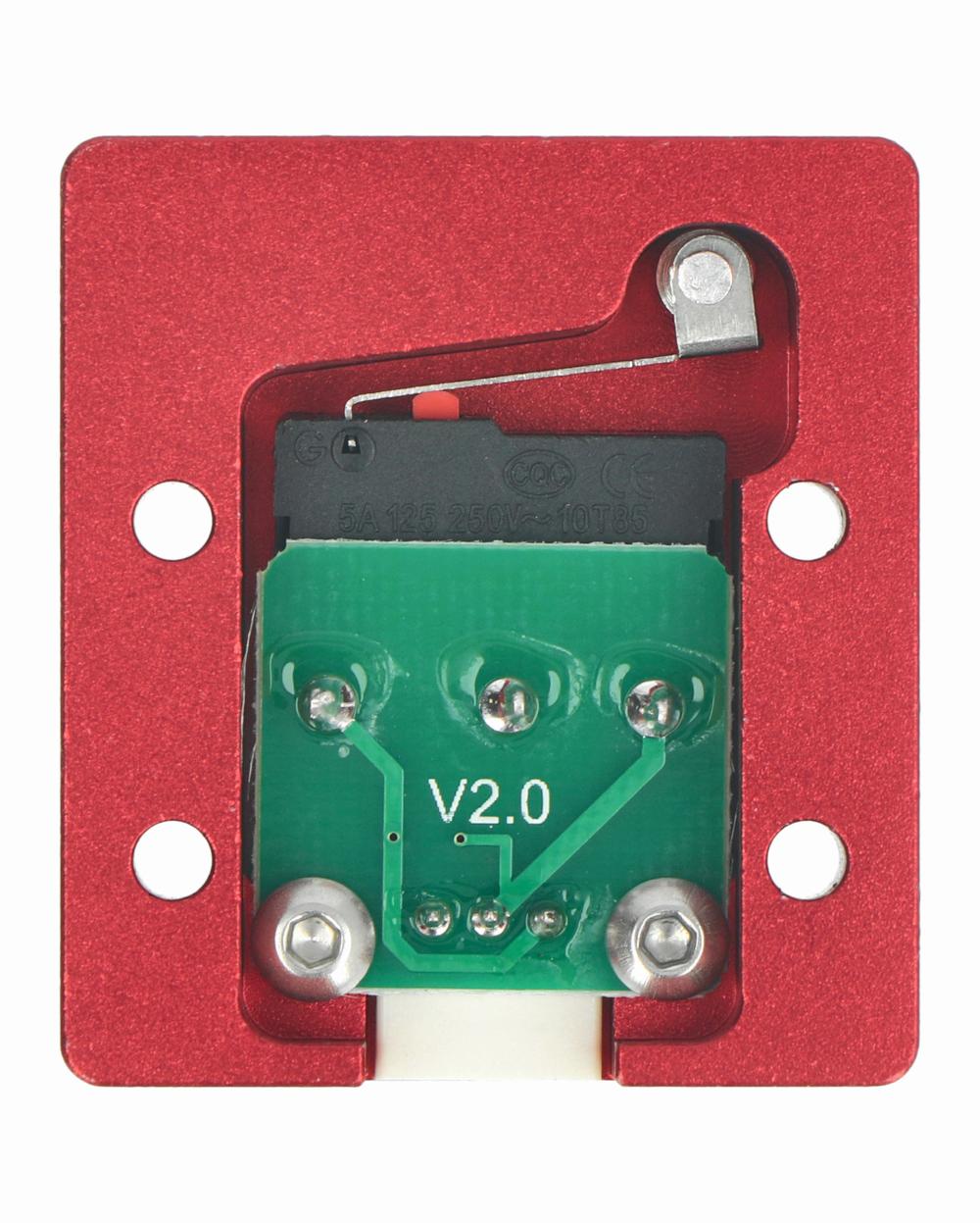 A red aluminum enclosure contains a green printed circuit board with a rocker switch.