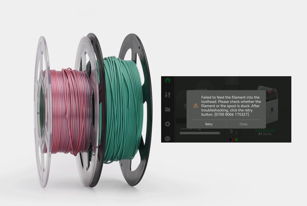 The image is of two spools of filament, one red and one green, with an error message on a screen saying Failed to feed the filament into the toolhead. Please check whether the filament or the spool is stuck. After troubleshooting, click the retry button.