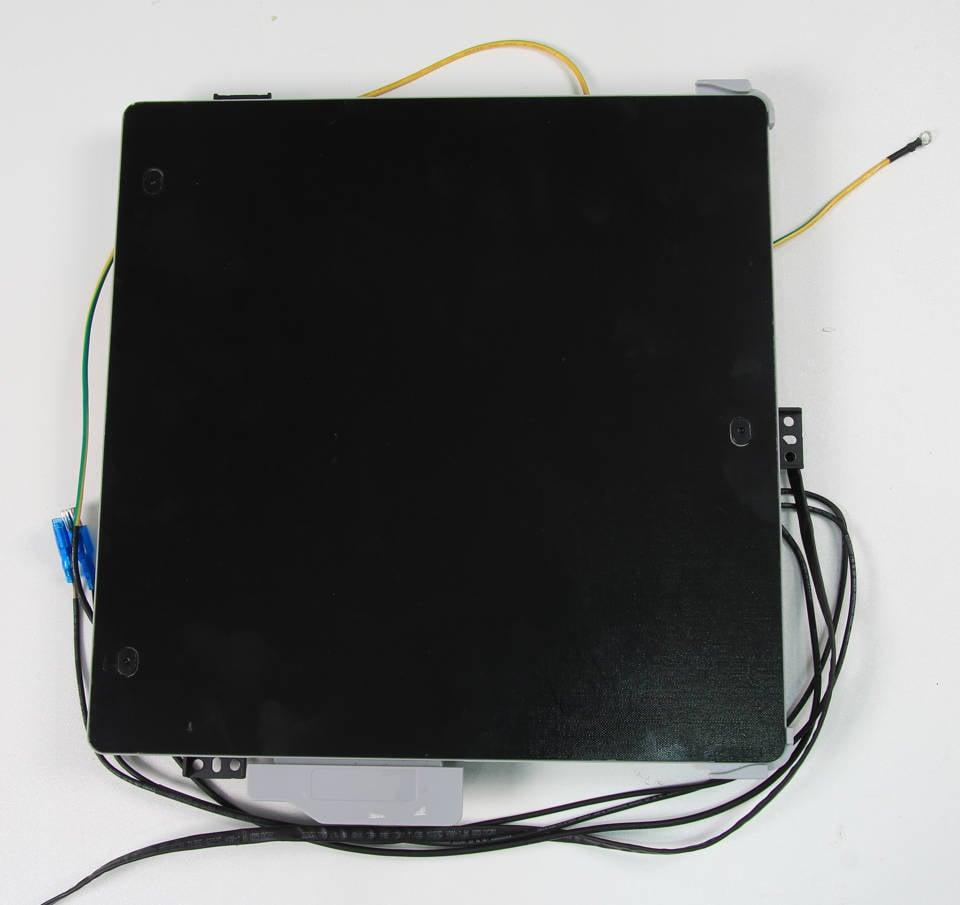 Black electronic device with a number of loose wires attached.