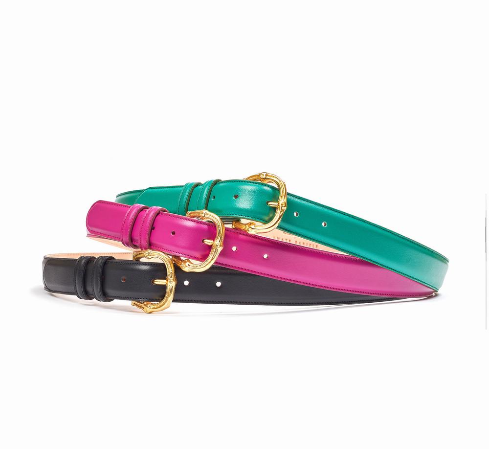 Three belts in black, hot pink, and teal are displayed on a white surface.