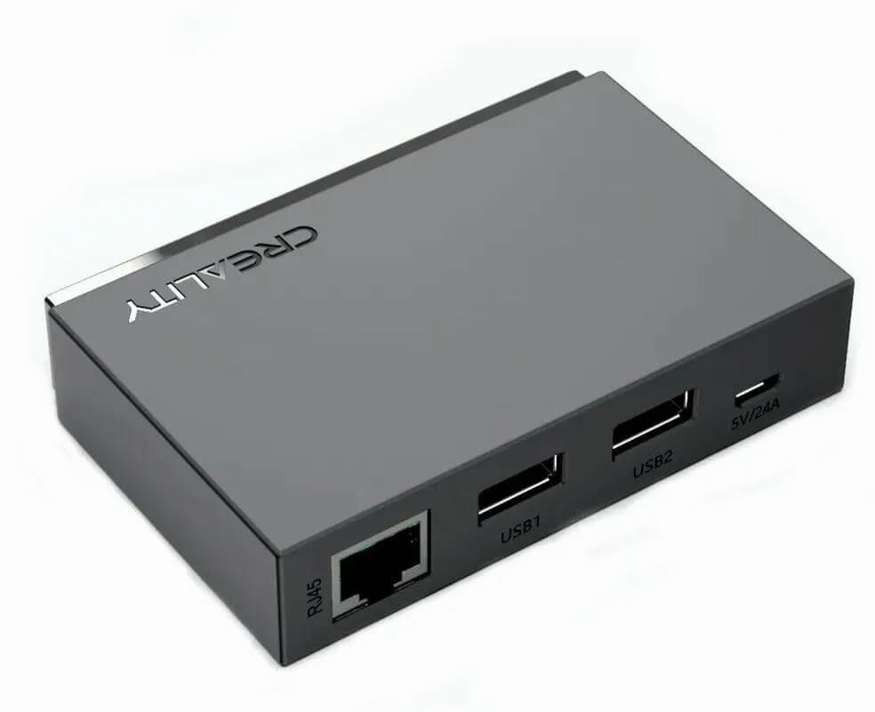 A black rectangular device with a number of ports on one side.