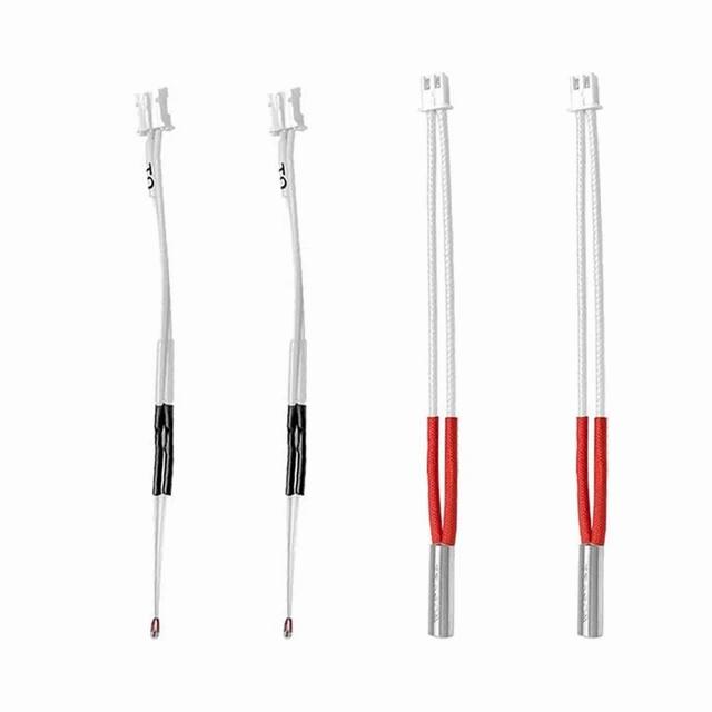 Two white thermistors and two white heating tubes with red ends.