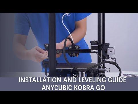 The video shows a person installing and leveling the Anycubic Kobra Go 3D printer.