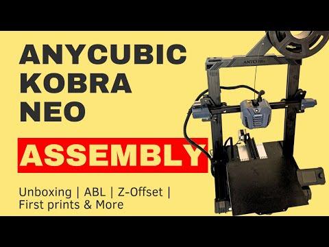 A man assembles an Anycubic Kobra Neo 3D printer.