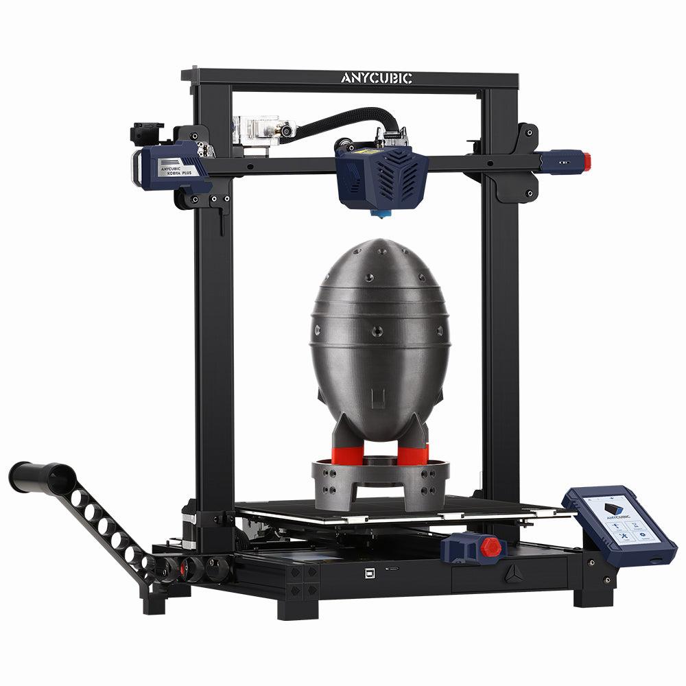 A black and blue Anycubic Kobra Plus 3D printer is printing a grey rocket ship.